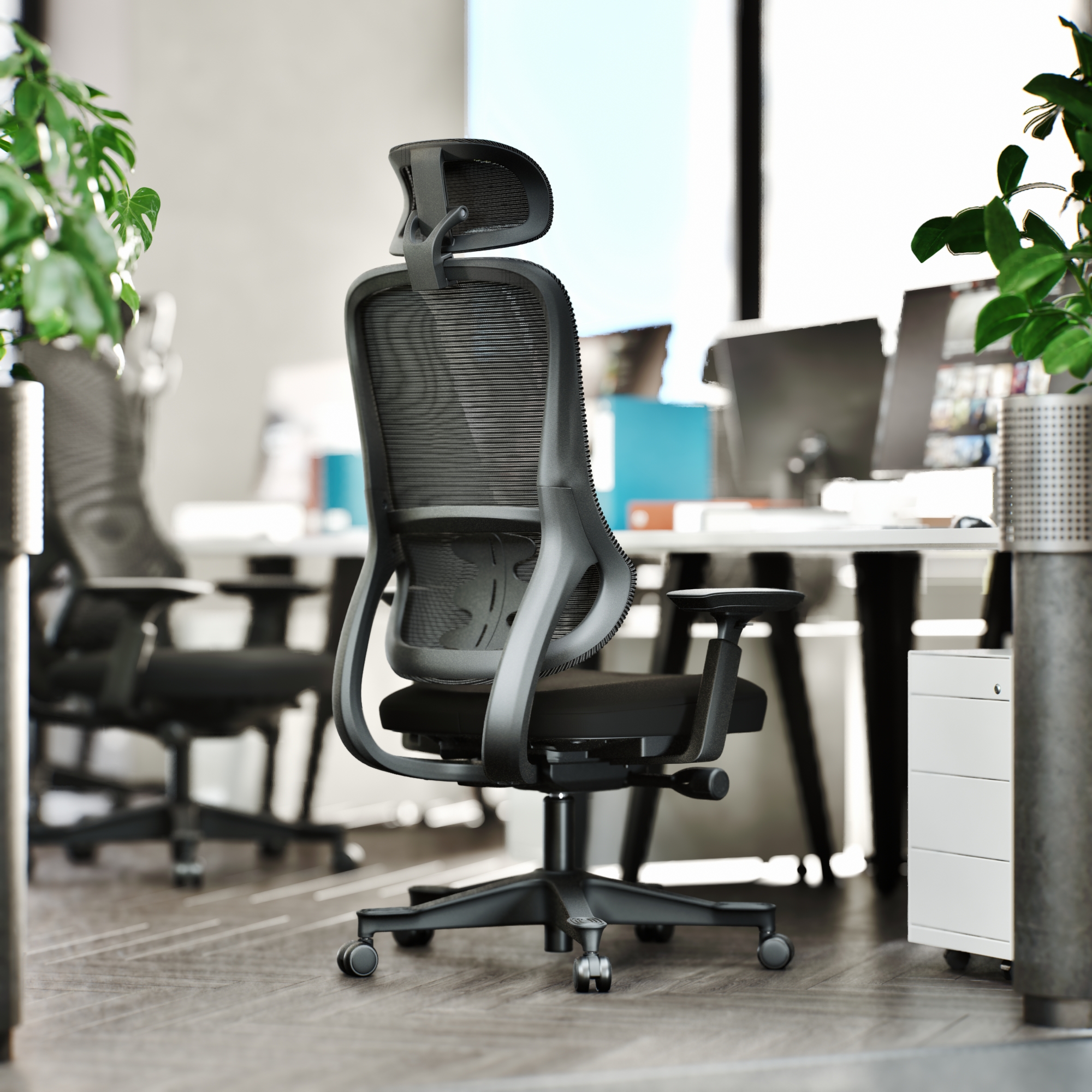 Close-up of the black Everything Chair in an office setting